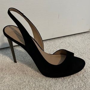 Black suede BCBG sling back heels with metal heels.
